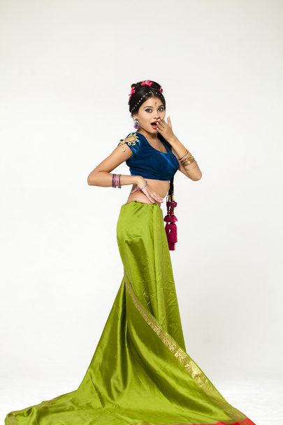 Young pretty woman in indian green dress - Foto, imagen