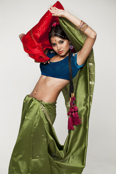 Young pretty woman in indian green dress - Foto, Imagen