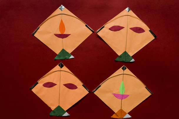 Uttarayan sankranti patang festival kites on red background for Sankranti greetings and wishes. Lohri Pongal festival of kites. - Photo, Image
