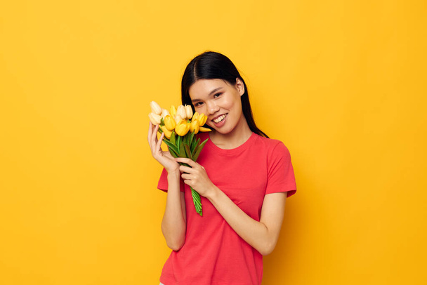 cheerful woman of asian appearance bouquet of flowers spring - Photo, Image