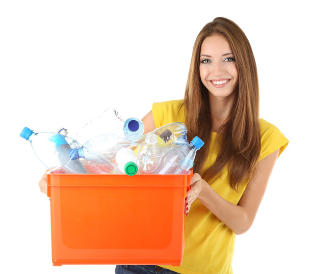 Young girl sorting plastic bottles isolated on white - Foto, imagen