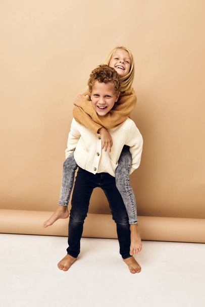 boy and girl together in sweaters fun casual wear - Foto, imagen