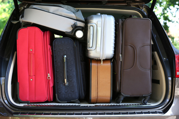 Suitcases and bags in trunk of car - Photo, Image