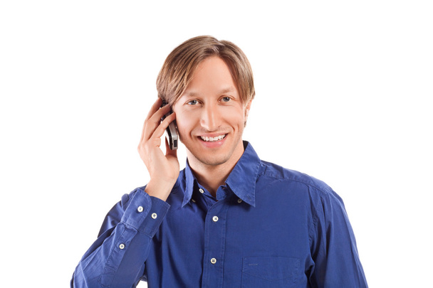 Бизнесмен разговаривает по мобильному телефону - Фото, изображение