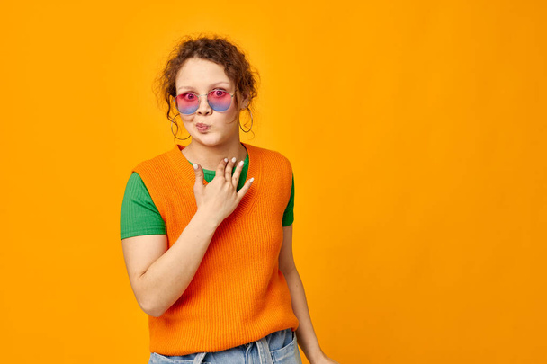 pretty girl orange sweatshirts sunglasses multicolored glasses supply cropped view unaltered - Valokuva, kuva