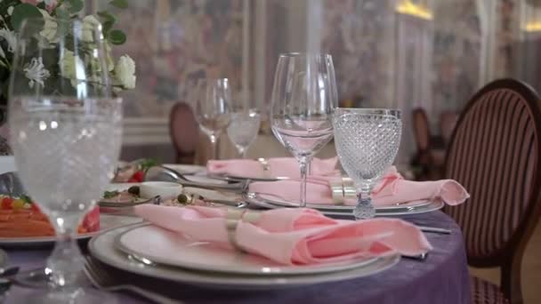 Served table in a restaurant for dinner, lunch or celebration. - Materiał filmowy, wideo