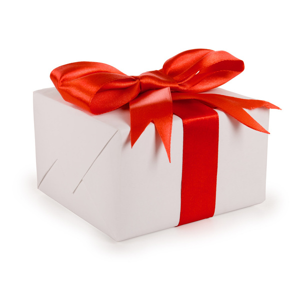 White gift box with red ribbon bow, isolated on white - Valokuva, kuva