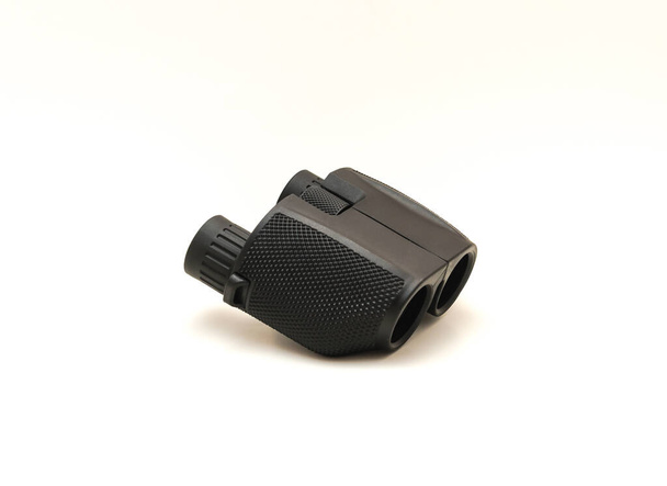 Side view a black compact Binoculars isolated on white background. - Photo, Image