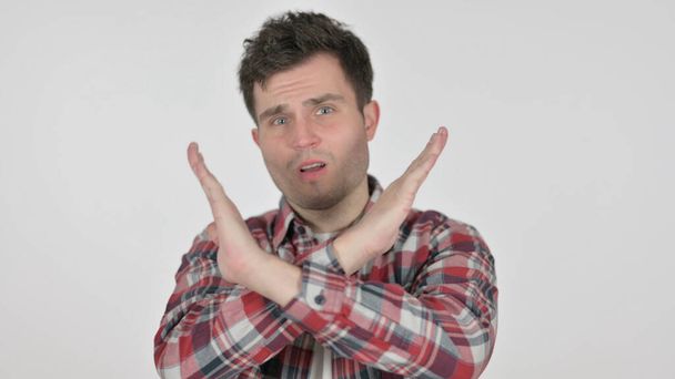 Portrait of Young Man Showing No Sign by Arm Gesture - Photo, Image