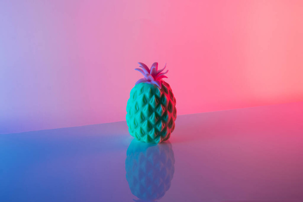 Pineapple in vibrant bold gradient holographic colors. Minimal surrealism concept art. - Φωτογραφία, εικόνα