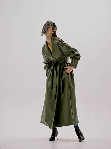 beautiful woman fashion leather coat glamor chain mail light background - Photo, Image