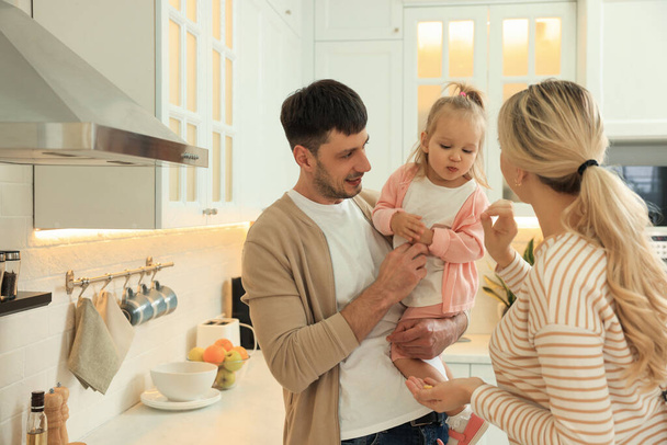 Happy family spending time together in kitchen - Foto, imagen