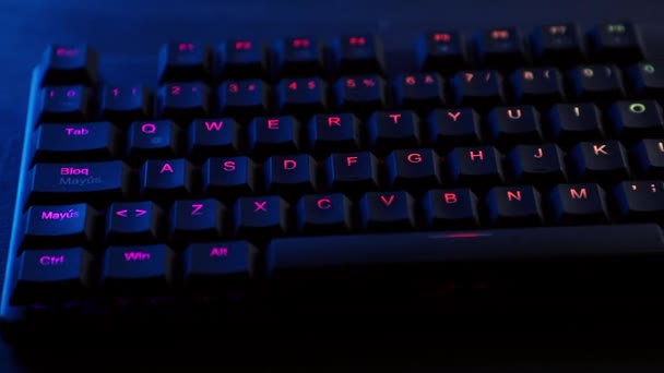 Mechanical keyboard panning with RGB lighting on a desk - Video, Çekim