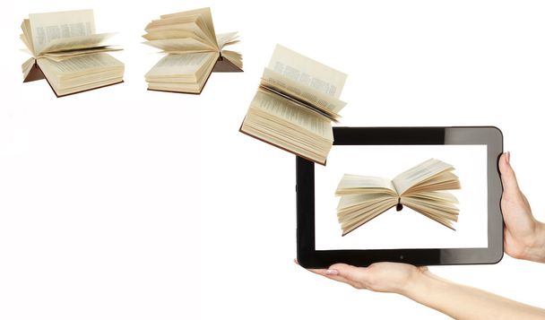 Books flying in tablet - Foto, imagen