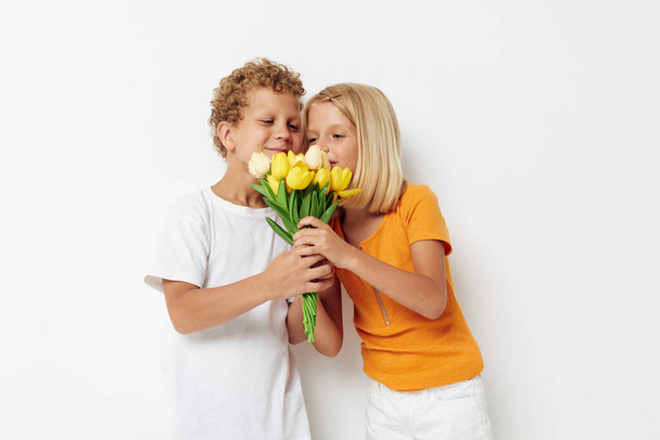 Small children with a bouquet of flowers gift birthday holiday childhood lifestyle unaltered - Photo, Image