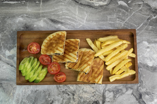 toast in wooden serving platter on marble background - Φωτογραφία, εικόνα