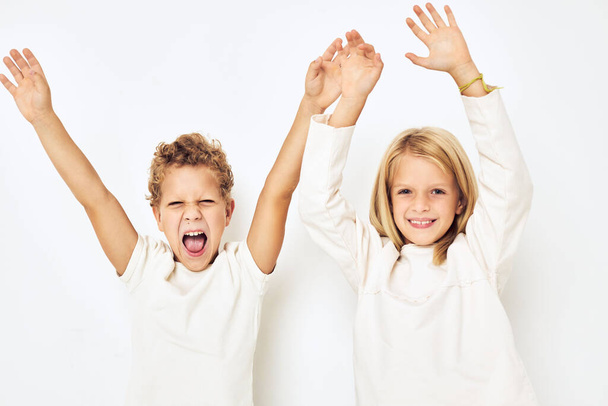 cheerful children dance gesticulate with their hands lifestyle - Zdjęcie, obraz
