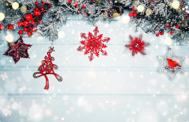 winter christmas background with decor on fir branches cones and snow on blue wooden texture                               - 写真・画像