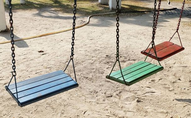 Children Playground, Empty Swing in Outdoor Park, A Hanging Seat, Often Found at Playgrounds for The Kids. - Valokuva, kuva