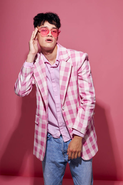 portrait of a young man plaid blazer pink glasses fashion modern style isolated background unaltered - Foto, Imagen