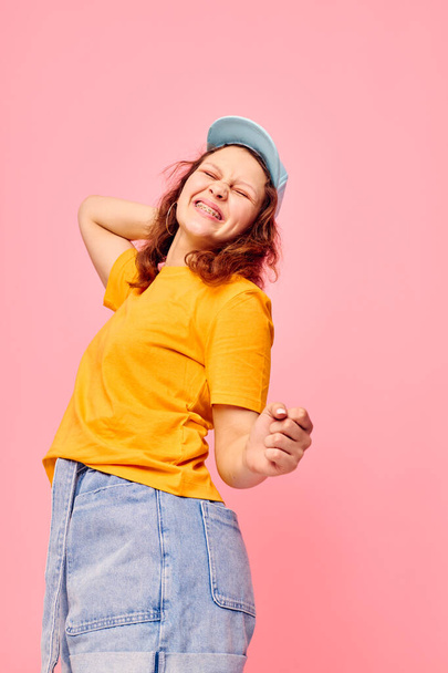 funny girl in a yellow t-shirt and blue cap posing emotions Lifestyle unaltered - Fotografie, Obrázek