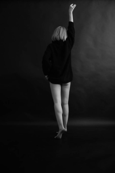 close-up photo of women's legs, black and white frame of feet - Fotó, kép