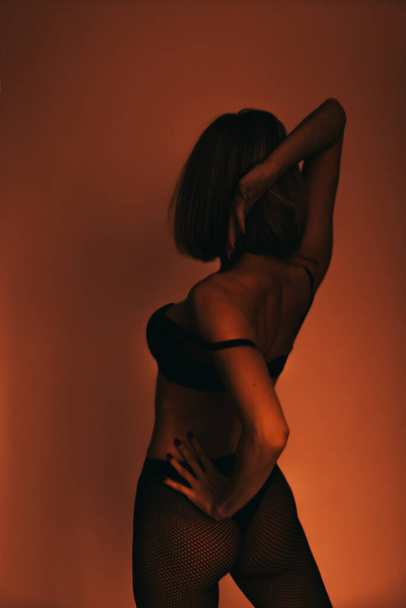 abstract orange silhouette of a woman - Fotografie, Obrázek