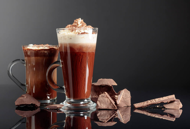 Hot chocolate with whipped cream and pieces of broken dark chocolate. - Φωτογραφία, εικόνα