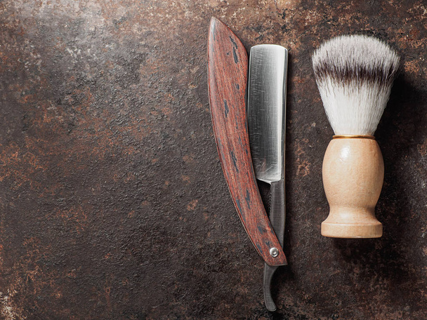 vintage barber tools. dangerous razor manual shaving brush. rusty background. top view flat lay - Photo, Image