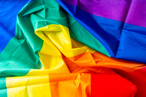 LGBTQ flag and symbol on table top view - Φωτογραφία, εικόνα