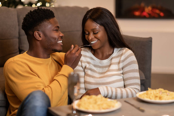African Couple Having Romantic Dinner Eating Pasta On Valentines Indoor - Photo, image