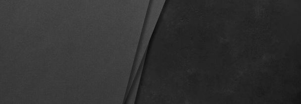 Black rectangular mockups on a dark concrete background. Design elements or portfolio. Copy space - Foto, Imagem