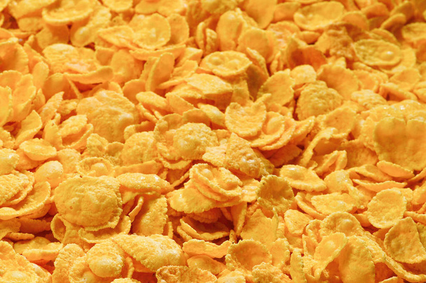 Corn-flakes background and texture. Top view. cornflake cereal box for morning breakfast. - Fotó, kép