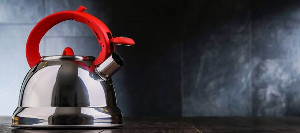 A stainless steel stovetop kettle with whistle - Foto, afbeelding