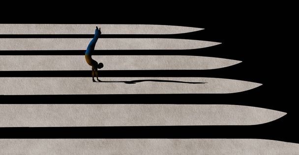 A man does a handstand in the light and shadows of a courtyard. This is a 3-d illustration - Photo, image