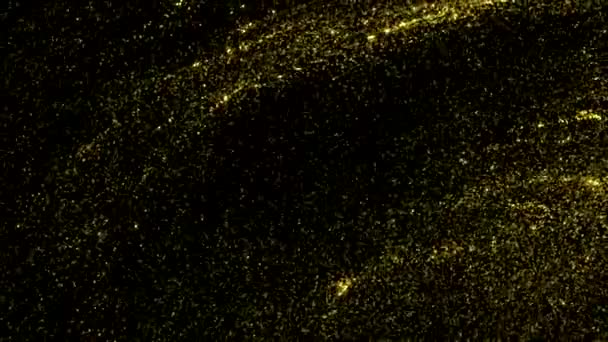 Flüssiger goldener abstrakter Hintergrund mit fließenden, glänzenden Partikeln auf schwarzem Hintergrund. Bewegung. Schöne wellige Textur mit gelb glänzendem Staub. - Filmmaterial, Video