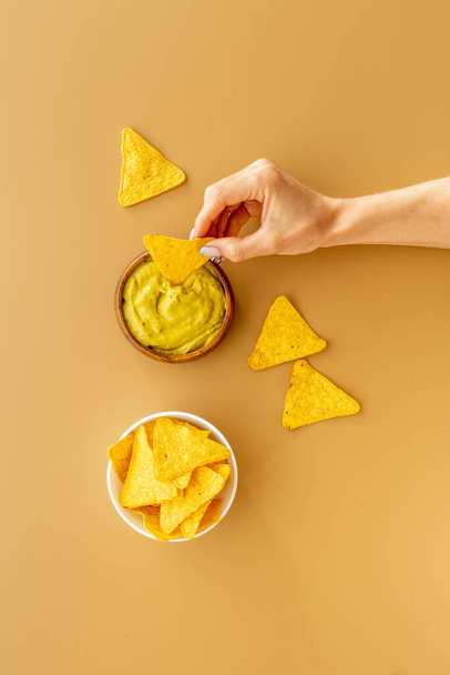 Corn nachos chips with avocado guacamole top view - Valokuva, kuva