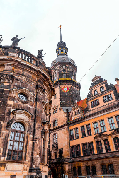 Dresden, Germany - December 19, 2021: Hausmannsturm tower and Dresden Cathedral Catholic Court Church in the old town or Altstadt of Dresden, Saxony, Germany. - Foto, Imagen