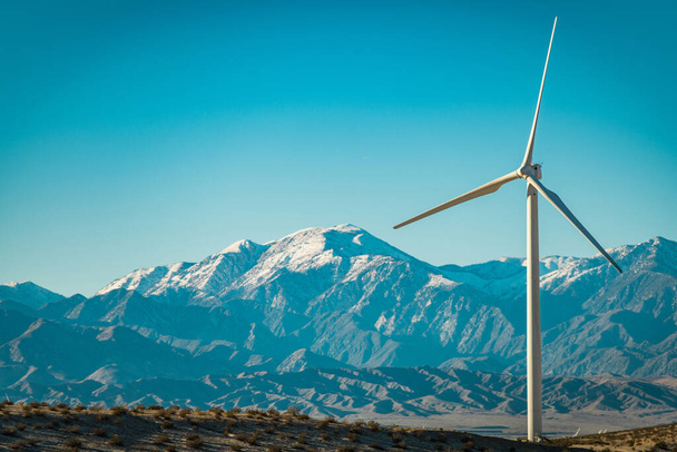 Wind Energy Plant Turbine and San Bernardino Mountains Covered by Snow, California USA. Green Energy Supply Theme. - Fotoğraf, Görsel