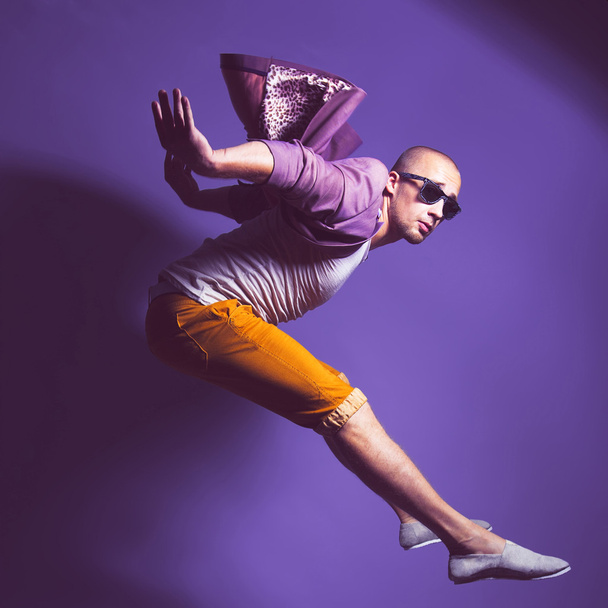 Young handsome male dancer in trendy glasses, purple jacket, whi - Foto, imagen
