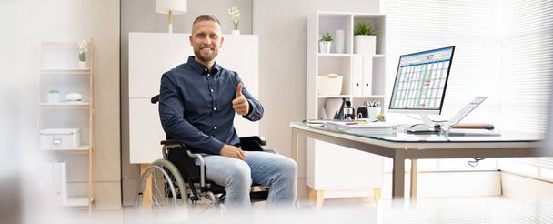 Happy Young Business Worker With Disability Using Computer - Foto, Bild