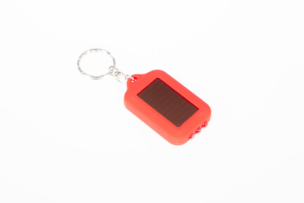 Solar key chain light powered LED keychain red plastic flashlight - Photo, Image