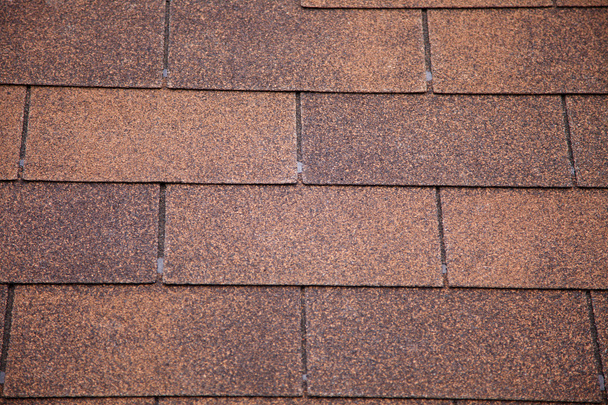 Brown asphalt roofing shingles. - Photo, Image