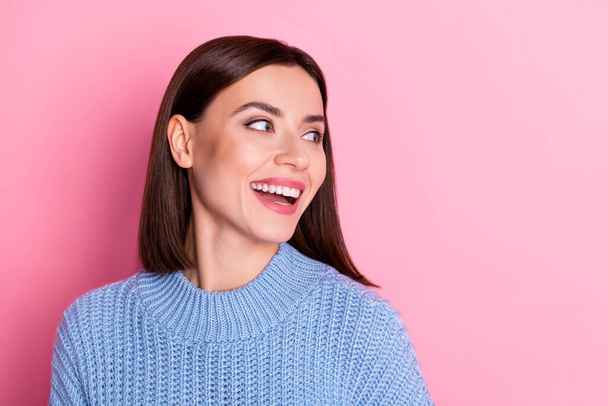 Portrait of attractive dreamy shine cheerful brunet girl looking aside having fun copy blank space isolated over pink pastel color background. - 写真・画像