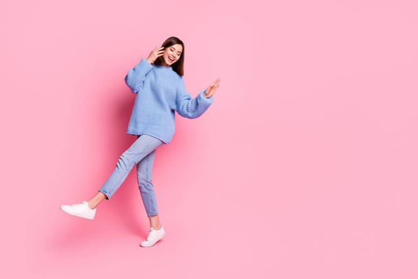 Full length body size view of attractive cheerful brown-haired girl dancing copy space isolated over pink pastel color background. - Фото, изображение