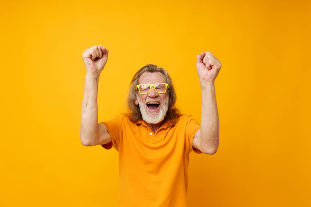 old man hand gestures emotions yellow glasses isolated background - Photo, Image