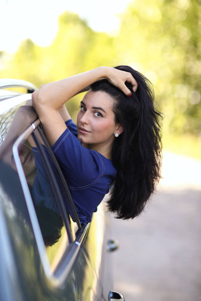 Woman being carefree in a vehicle - Photo, Image