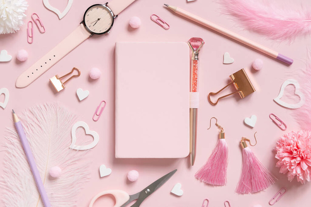 Hardcover notebook, Pink school accessories and hearts on light pink, Top view, textbook mockup. Girly workplace with notebook, scissors, pencil, pen, paperclips, earrings and watch. Back to school  - Foto, Bild