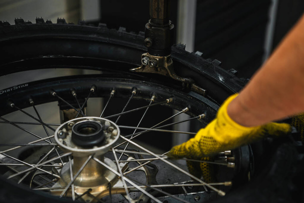 Almeria, Spain - May 4th 2021: Enduro motorbike tyres service during Dunlop Xperience showroom and test in Almeria, Spain. - Foto, afbeelding