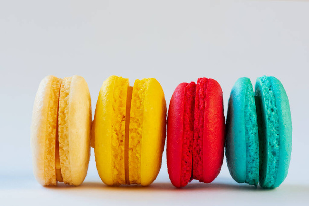 Row of multicolor cookies on white background. - Zdjęcie, obraz